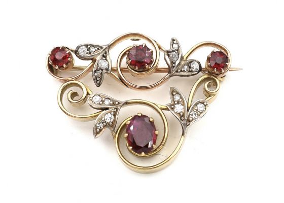 Garland style ruby and diamond brooch in yellow gold