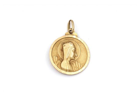 Religious 14kt yellow gold plated circular pendant