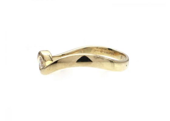 Diamond twist ring in 9kt yellow gold