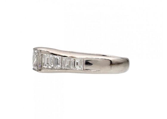 Rectangular diamond flanked solitaire engagement ring in platinum