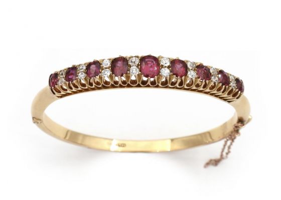 Antique ruby and diamond hinged bangle in yellow gold