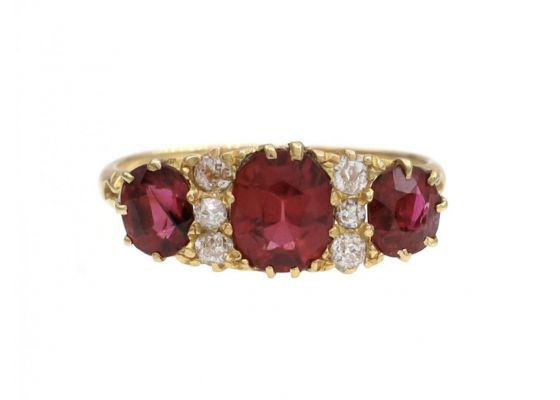 Victorian ruby and diamond three stone carved ring in 18kt yellow gold