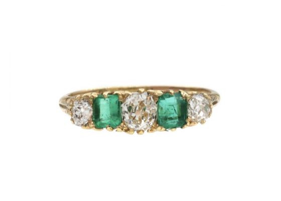 Antique diamond and emerald five stone carved ring