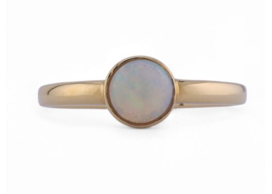 Contemporary bezel set opal solitaire ring in 18kt yellow gold – Matthew Weldon