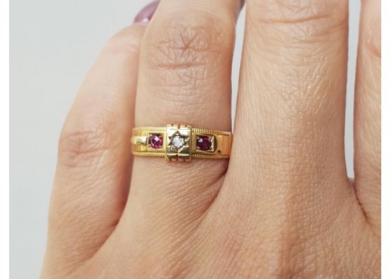 Antique diamond and ruby buckle ring in 18kt yellow gold