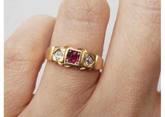 1897 ruby and diamond three stone flush set ring in 18kt gold