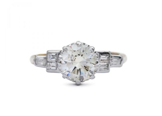 1950s 1.30ct round diamond solitaire with baguette shoulders in gold