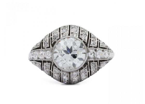 Art Deco diamond set bombe solitaire engagement ring in platinum