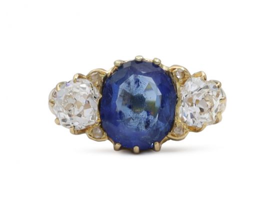 Antique sapphire and diamond graduating three stone engagement ring in gold