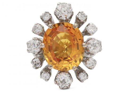 Modern 6.52ct fancy yellowish orange sapphire and old cut diamond cluster ring