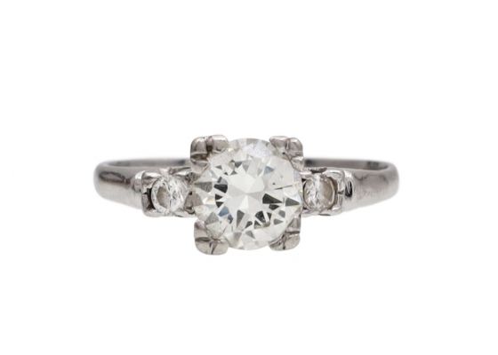 Vintage flanked diamond solitaire engagement ring in platinum