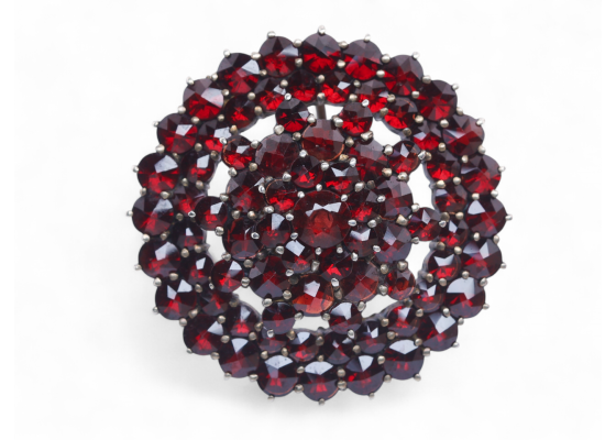 Antique silver gilt brooch set with rose-cut garnets in a domed circular cluster